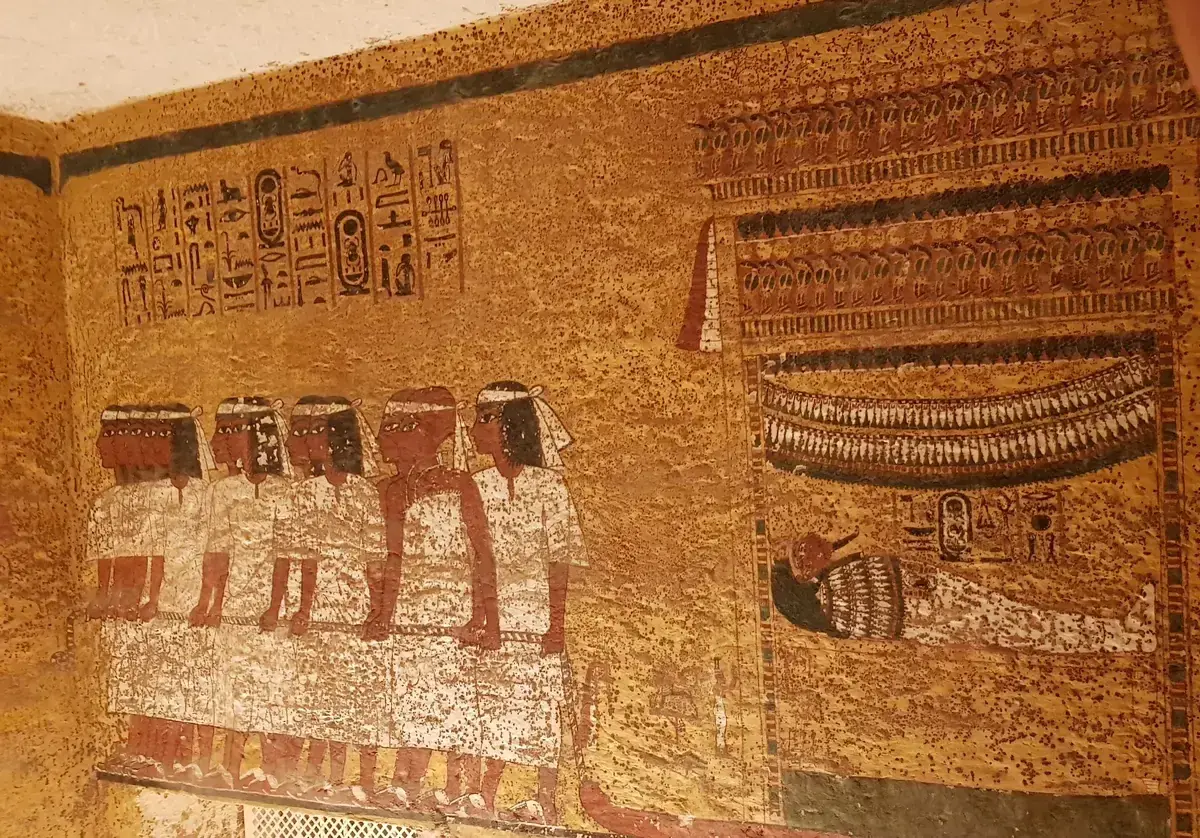 Painted procession of figures on the burial chamber wall of Tutankhamun's tomb KV62, seen on a Valley of the Kings tour